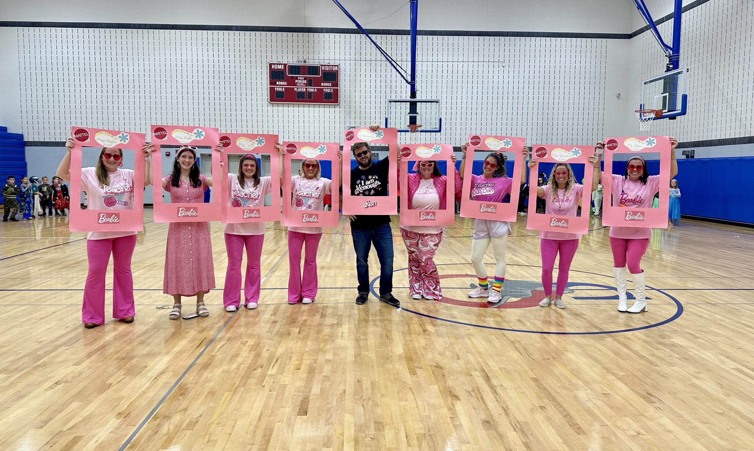 1st grade teachers dressed up as Barbie and Ken for Halloween Parade